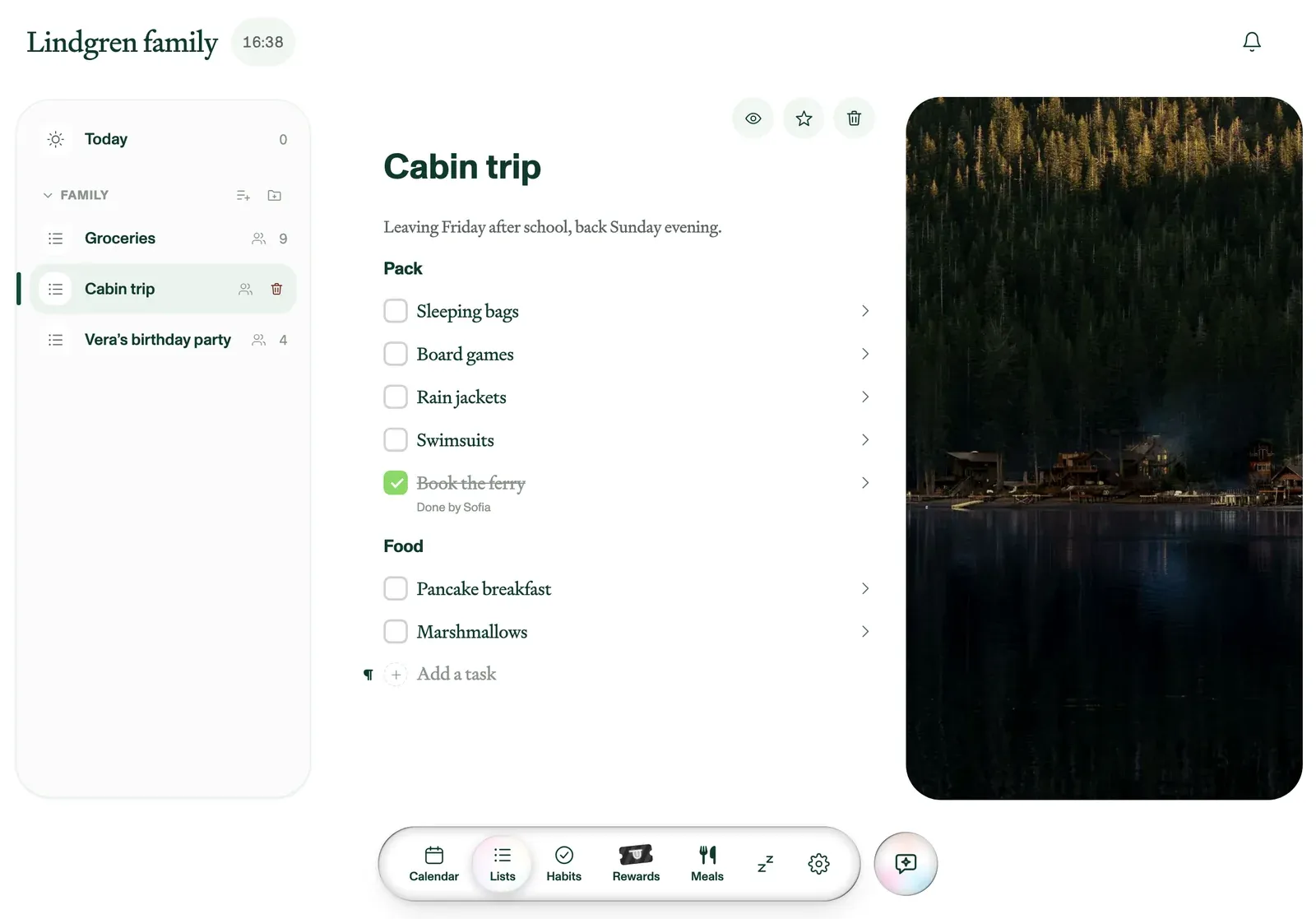 A packing list for a cabin trip, grouped into Pack and Food, with a photo of a lakeside cabin.
